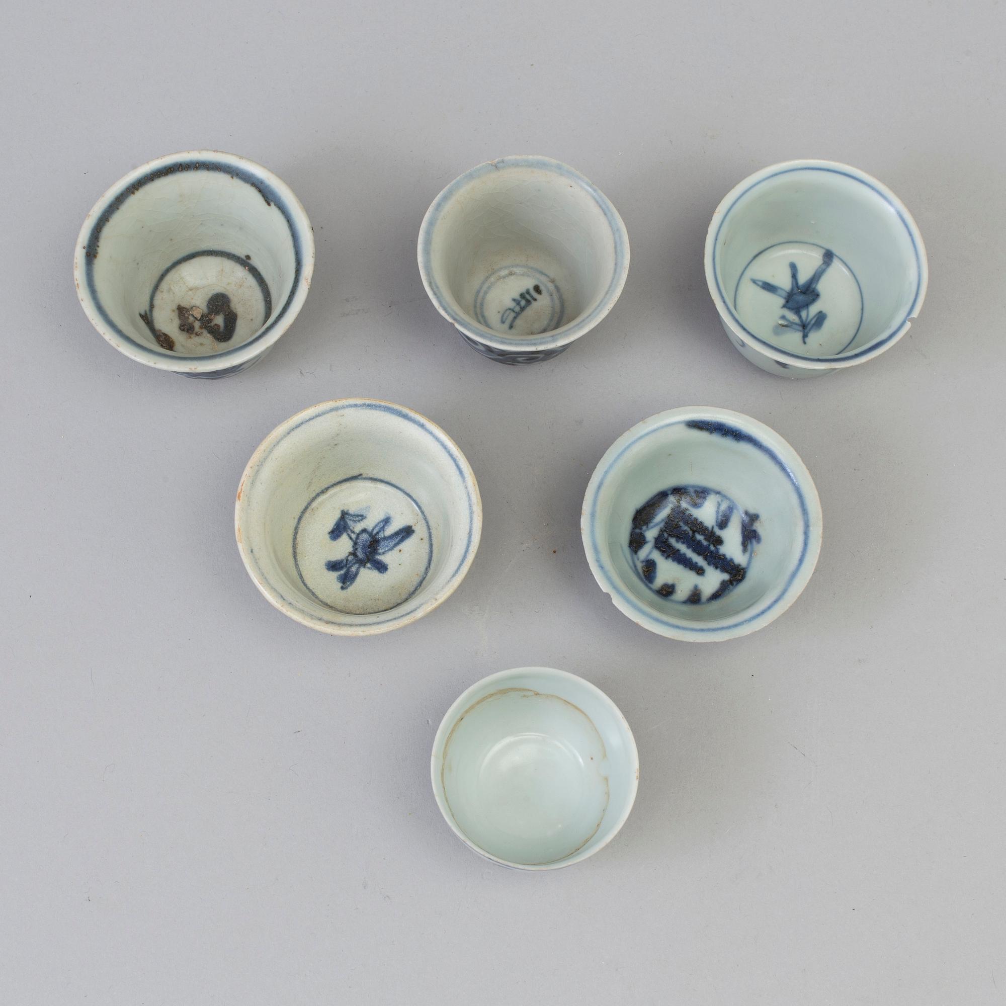 A set of six odd blue and white cups, Ming dynasty (1368-1644).