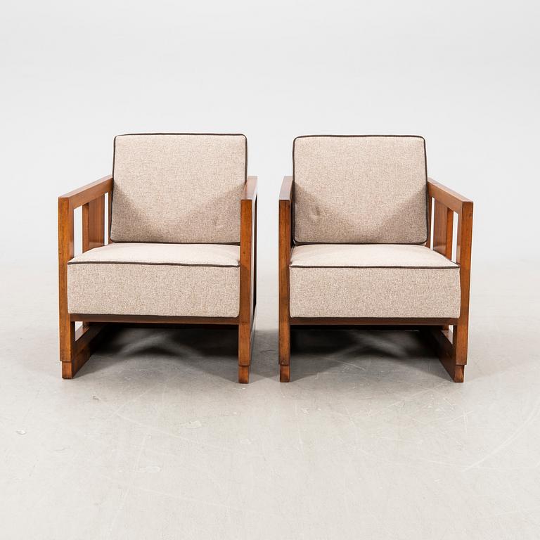 A pair of lacquered wood art déco armchairs from the first half of the 20th century.