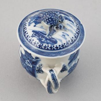 A set of six blue and white custard cups with covers,