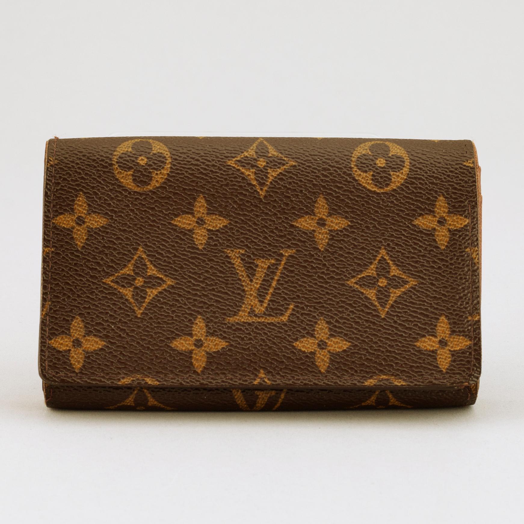 LOUIS VUITTON, a monogram canvas wallet.