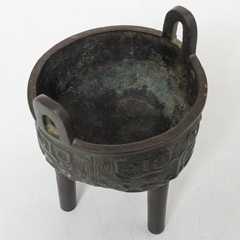 A Chinese tripod bronze censer, Ming style, Qing dynasty (1644-1912).