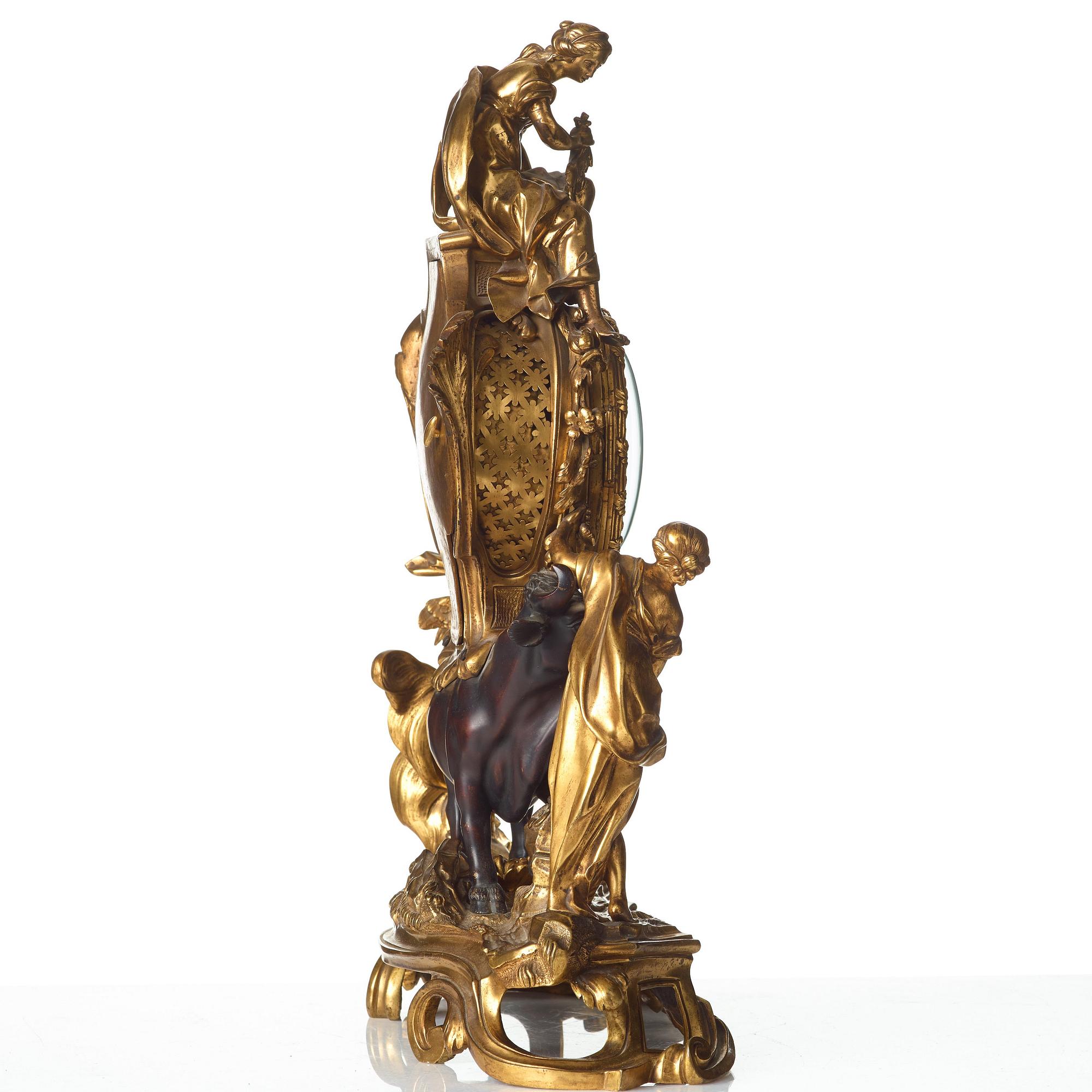 A Louis XV-style late 19th century mantel clock.