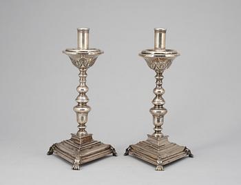 A pair of possebly Spanish or South American 18th century candelsticks, unidentified makers mark.