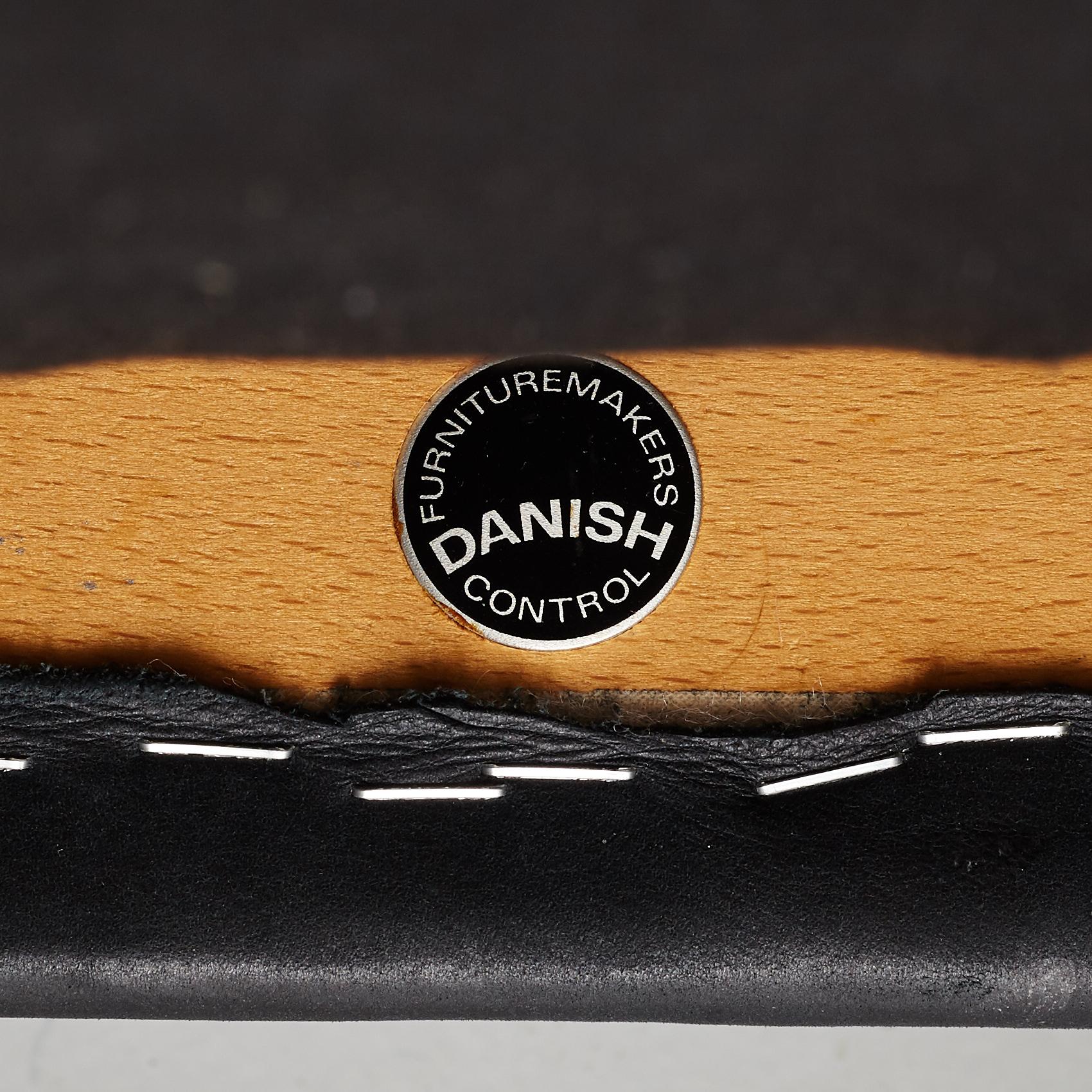 Niles Otto Møller, a rosewood veneered table with four chairs, JL Møller, Denmark, 1950's/60's.