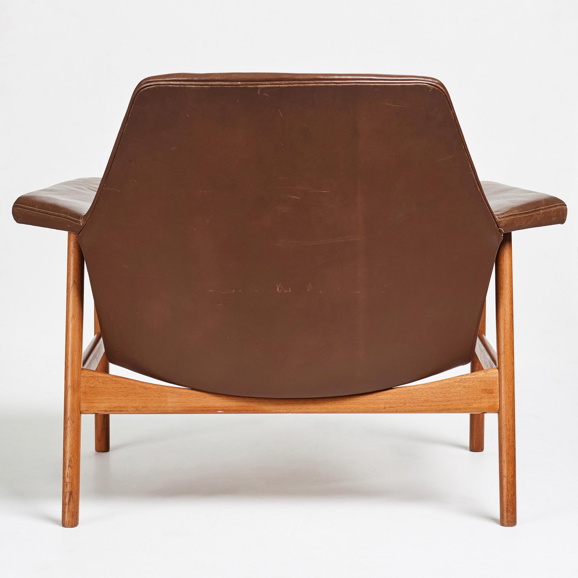 Ib Kofod-Larsen, a teak and brown leather easy chair, Olof Perssons Fåtöljindustri (OPE), Sweden, 1950-60's.