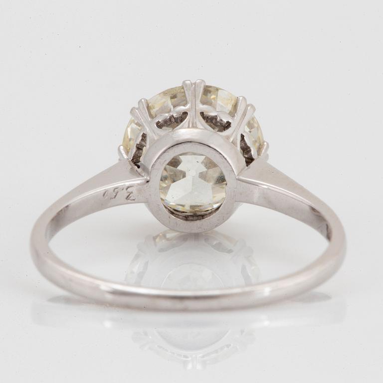 A platinum ring set with an old-cut diamond 3.50 cts according to engraving.