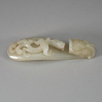 A carved white nephrite belt hook, Qing dynasty (1644-1912).