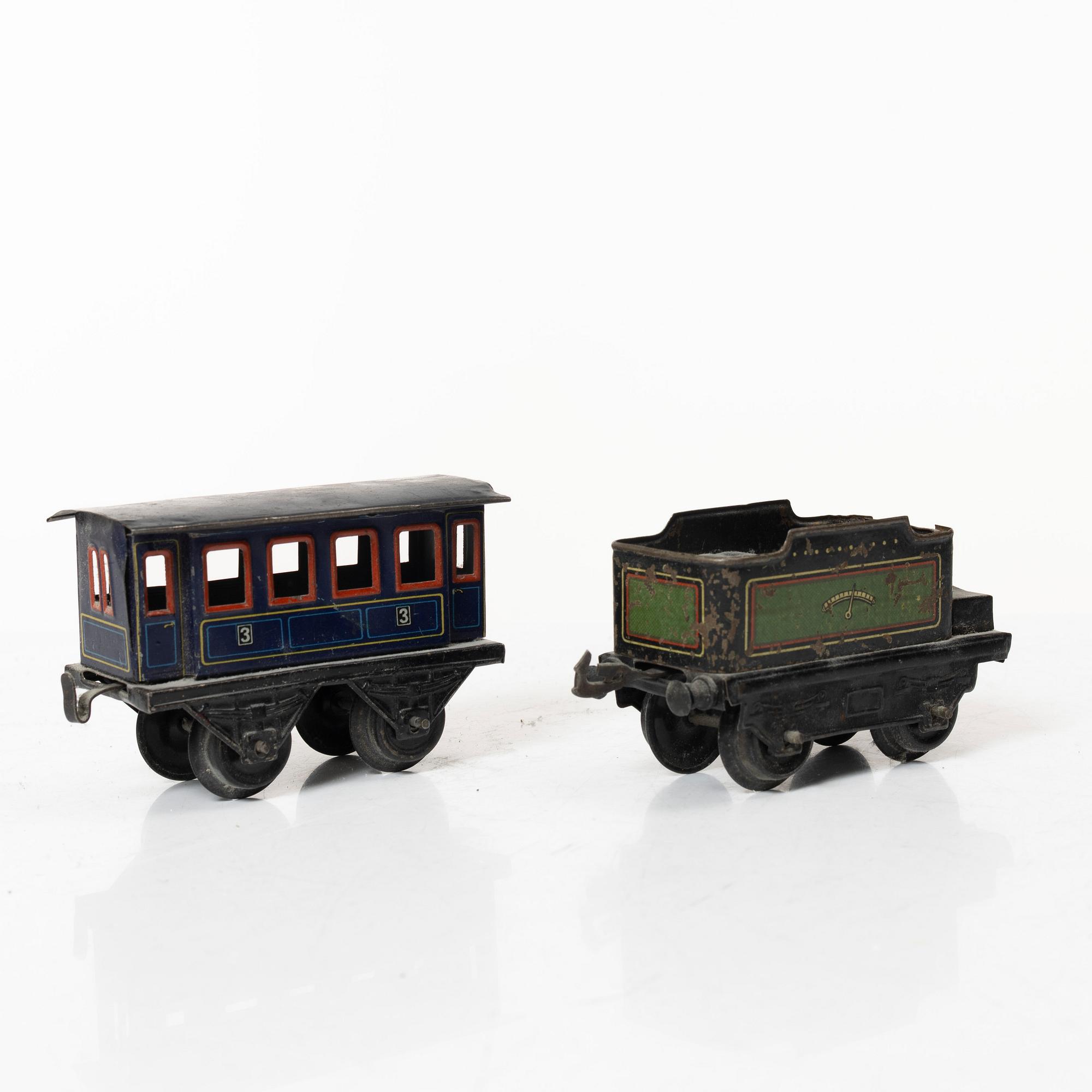 Model train with track and station building, 13 pieces, Germany, 1920s.