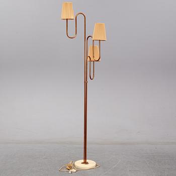 A 20th century Swedish Modern three-armed floor light.