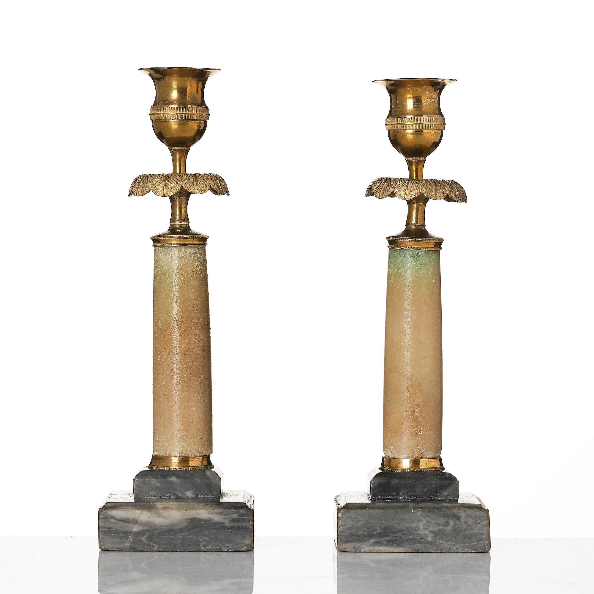 A pair of late Gustavian gilt brass and marble candlesticks, Stockholm, late 18th century.