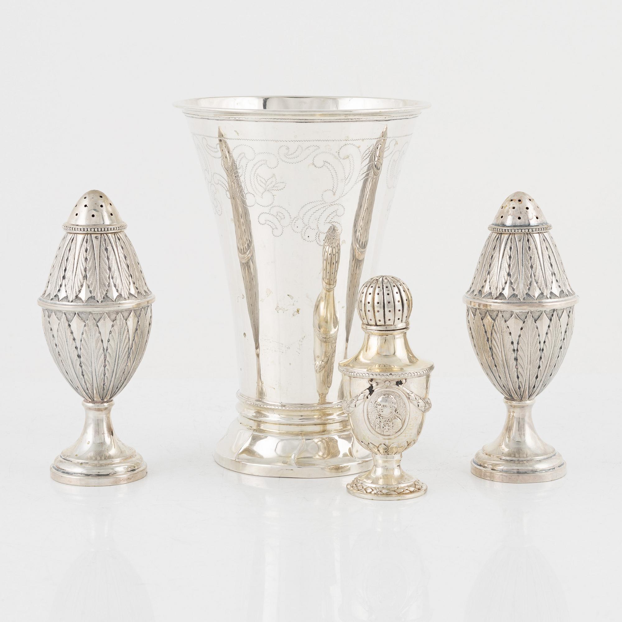 Three Silver Shakers and a Beaker.