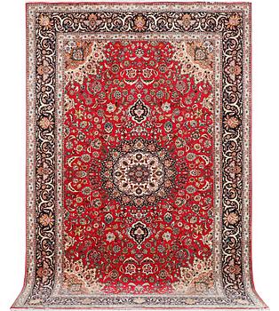 A Tabriz, 50RAJ, part silk carpet, c. 325 x 208 cm.