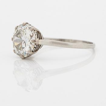 A platinum ring set with a round brilliant-cut diamond weight ca 4.90 cts quality ca W si.