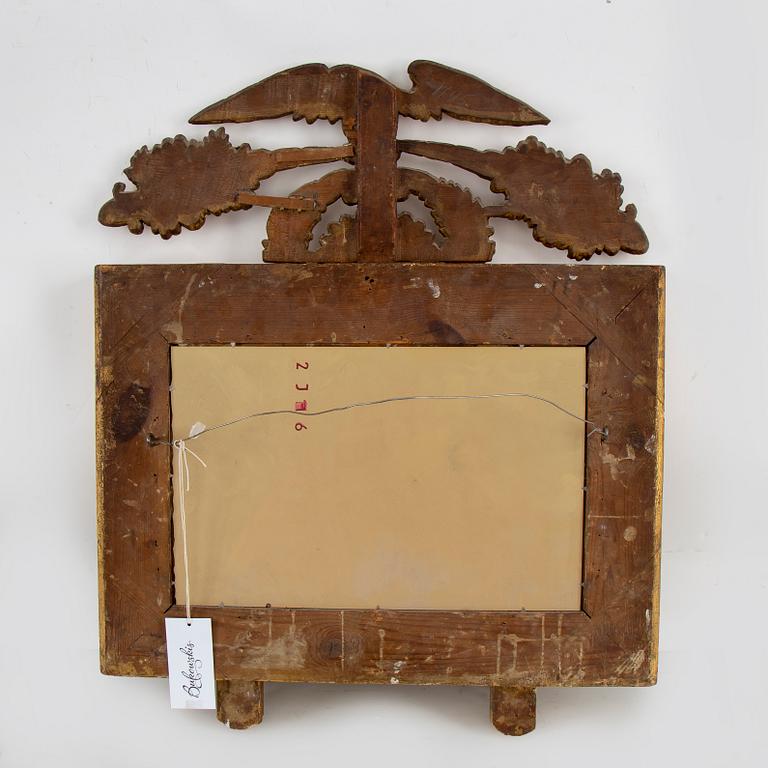 A first half of the 19th century mirror wall sconce.