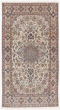 An old Nain carpet, c. 300 x 165 cm.