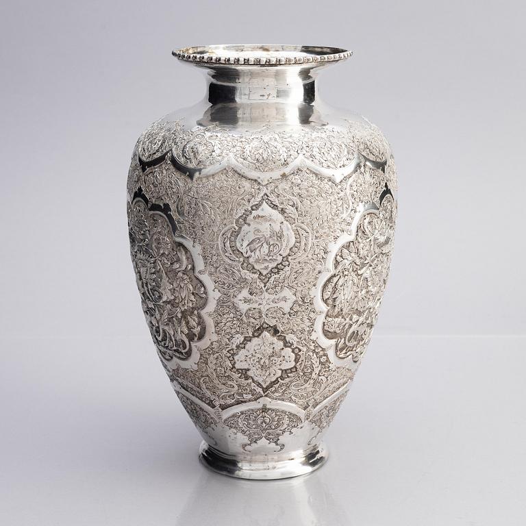 A Persian silver vase, late Qajar dynasty around 1910.