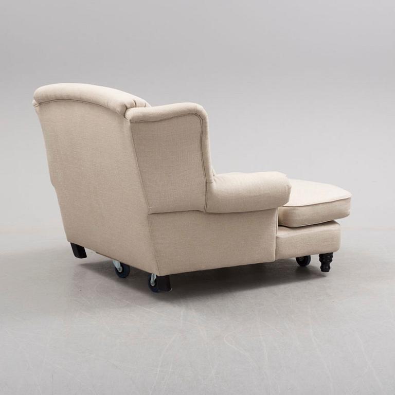A 'Howard' wing-chair, 21st Century-.