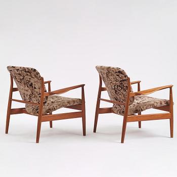 Finn Juhl, a pair of "FD 136" easy chairs, France & Daverkosen, Denmark, 1950s.