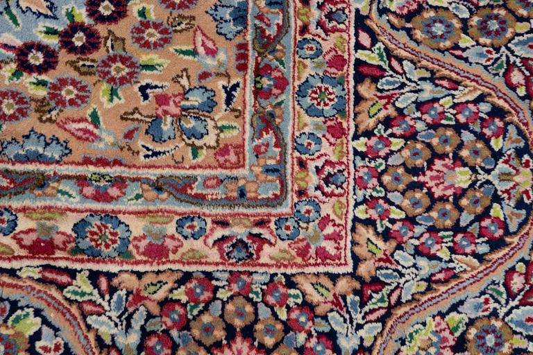 An oriental carpet, c. 385 x 300 cm.