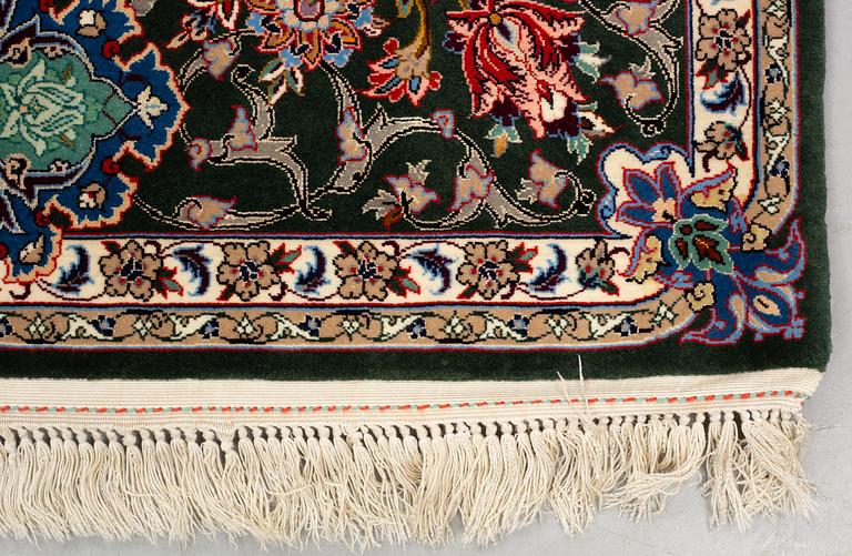 A rug, old Esfahan, part silk, signed, ca 225 x 149 cm (ca 1,5-2,5 cm flat weave at the ends).