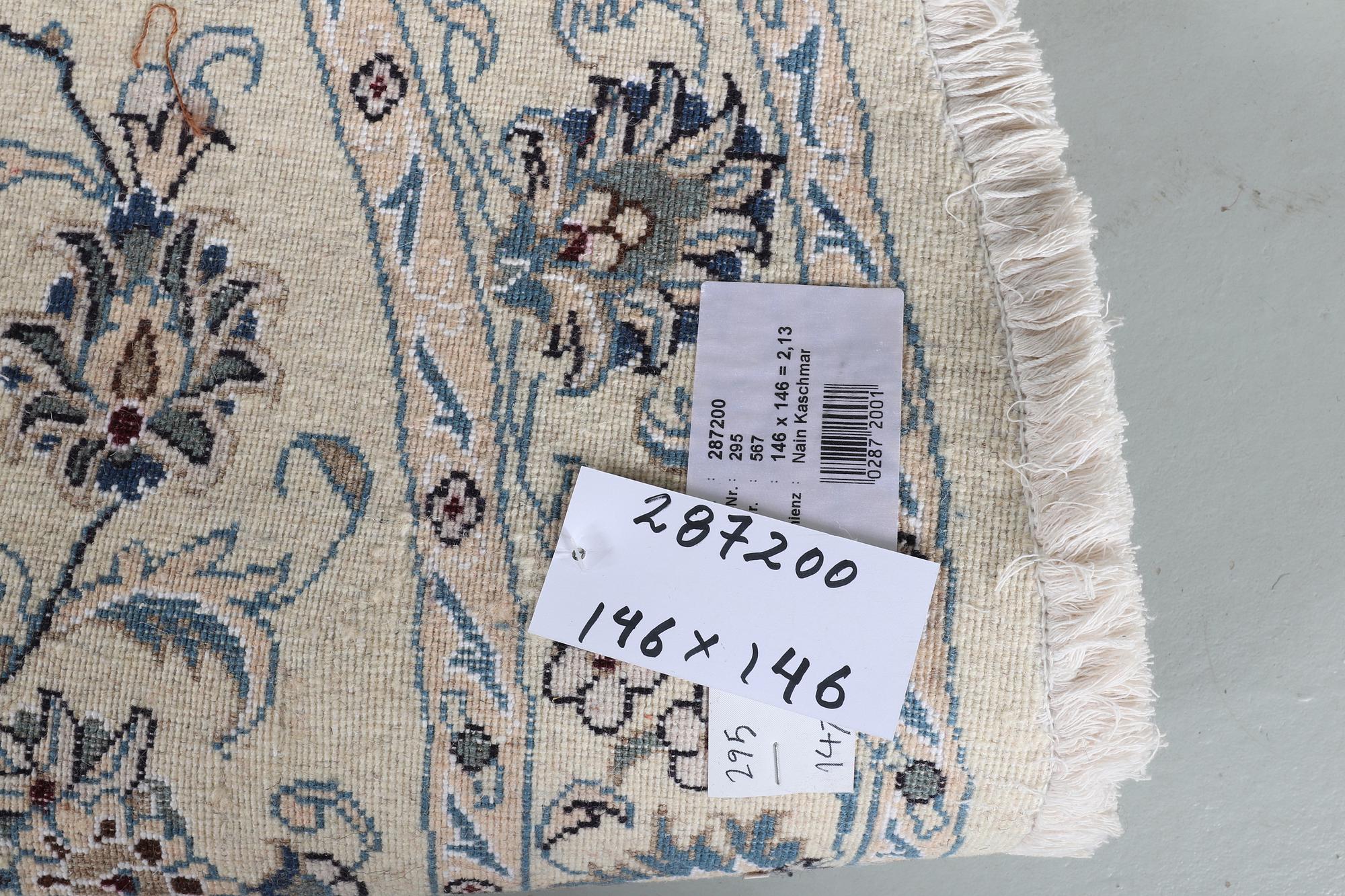 A rug, Nain, part silk, ca 146 x 146 cm.