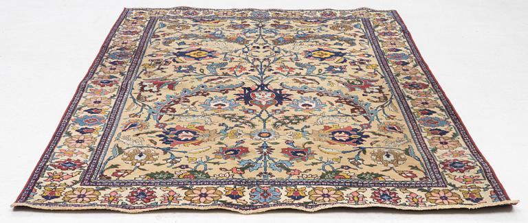 A semi-antique Tabriz of  'Sickle-Leaf' design, c 240 x 161 cm.