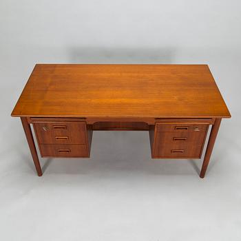 A wooden mid 20th century desk.