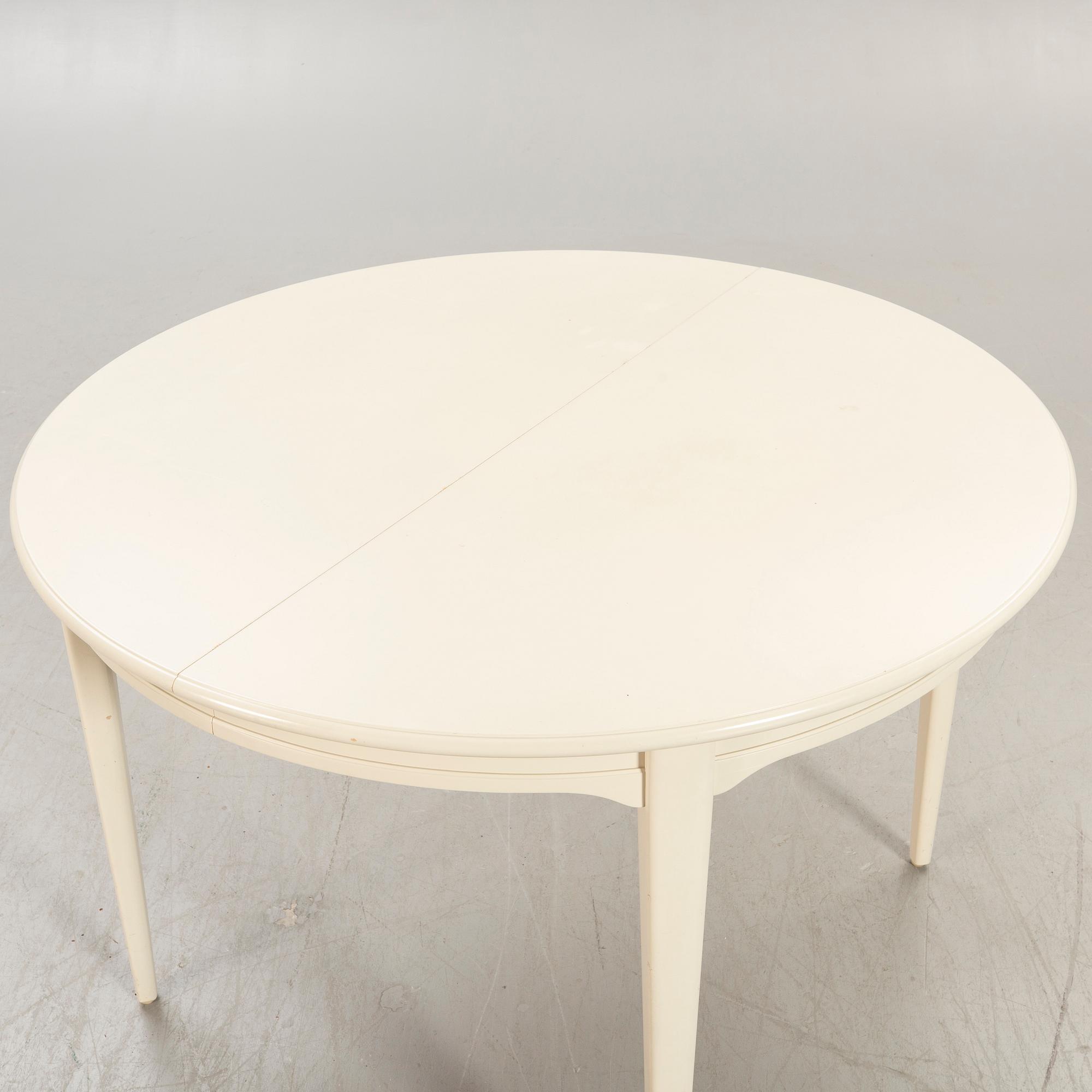 Svante Skogh, dining table plus 2 extension leaves, 4 chairs, second half of the 20th century.