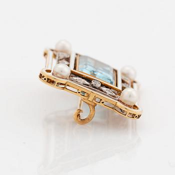 An 18K gold and enamel brooch set with a faceted aquamarine, pearls and old-cut diamonds.