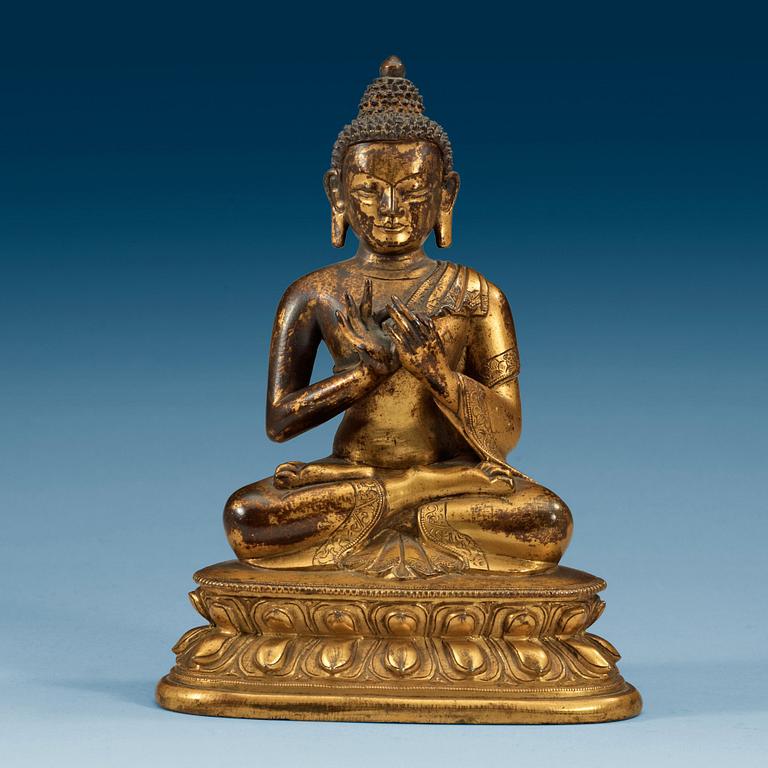 A gilt bronze figure of Buddha, Sinotibetan, 18th Century.