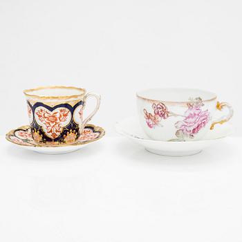 A set of 12 pair of porcelain mustache cups, including Germany, 19th and 20th century.