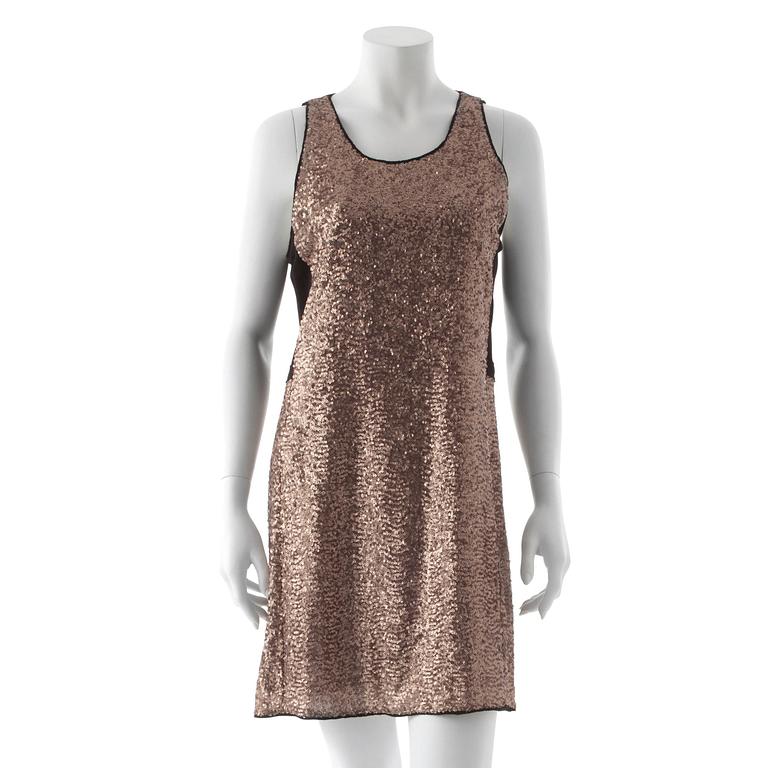 SAND red carpet, a sequin embellished dress.