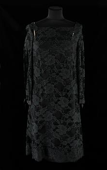 661. A 1970s black evening dress by Frank Usher.