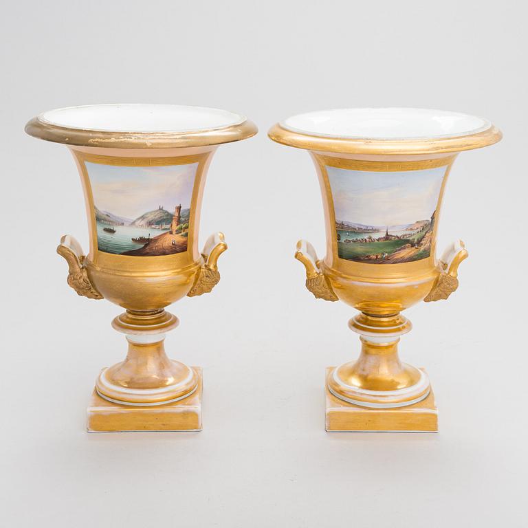 A pair of German porcelain urns from around the mid-19th century.
