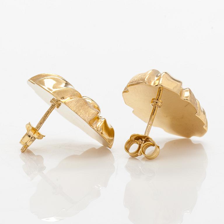 A pair of 14K gold earrings.