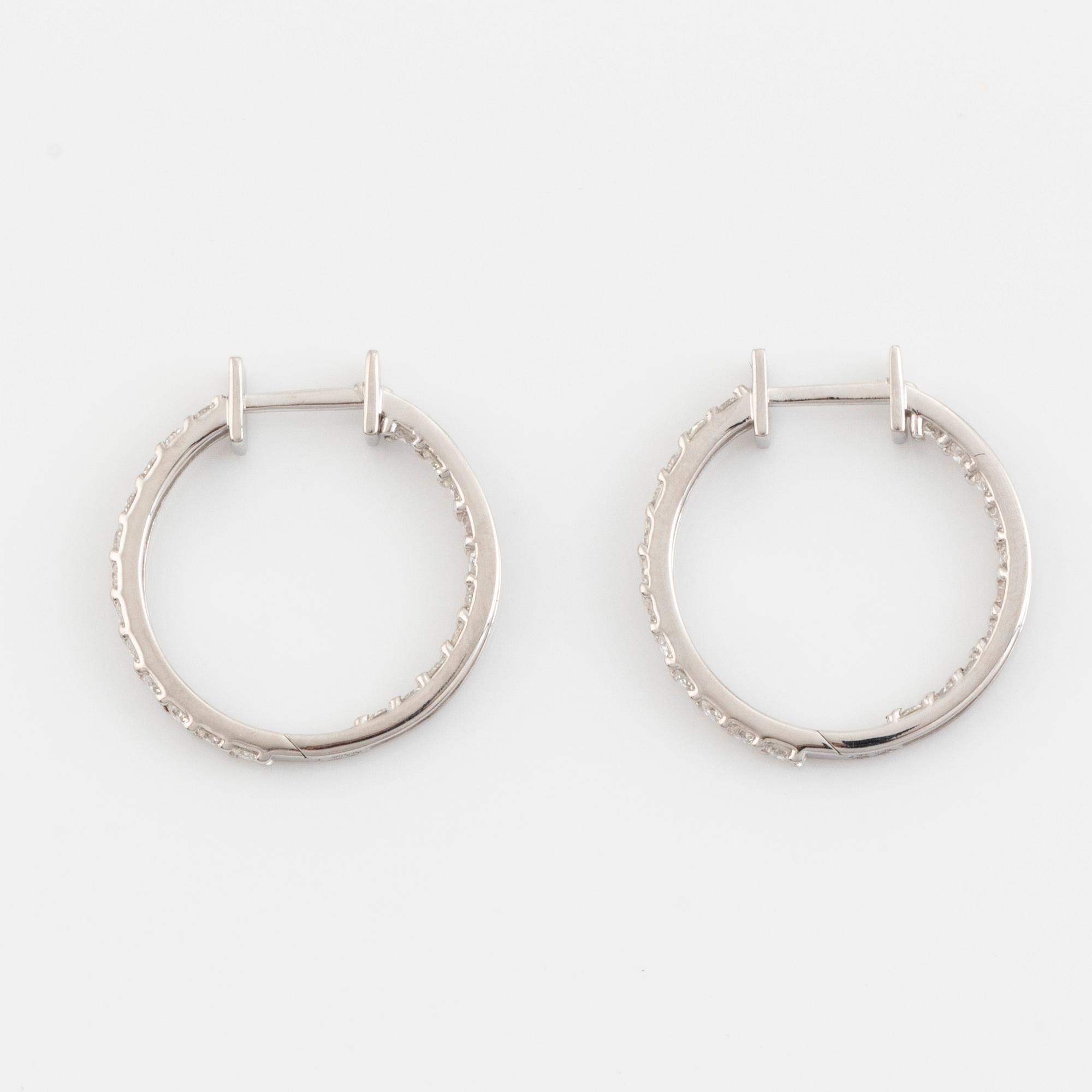 Brilliant cut diamond hoop earrings.