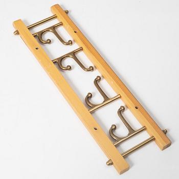 A set of three 'Decorative' coat hangers, Skoglunds metallgjuteri, Anderstorp, 1950s/60s.