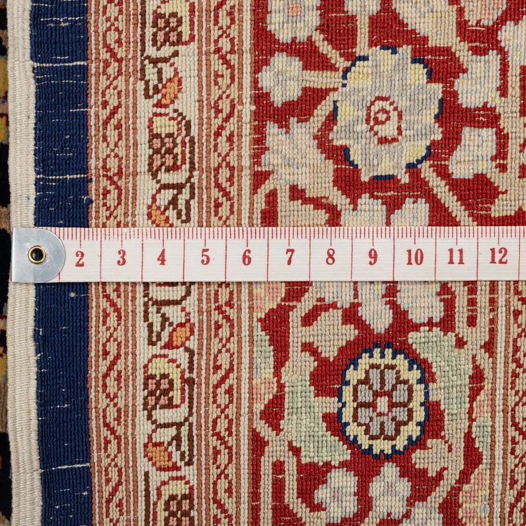 A Hereke silk rug, c. 130 x 71 cm.