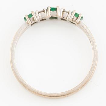 Ring, eternity ring 18K white gold with emeralds and brilliant-cut diamonds.