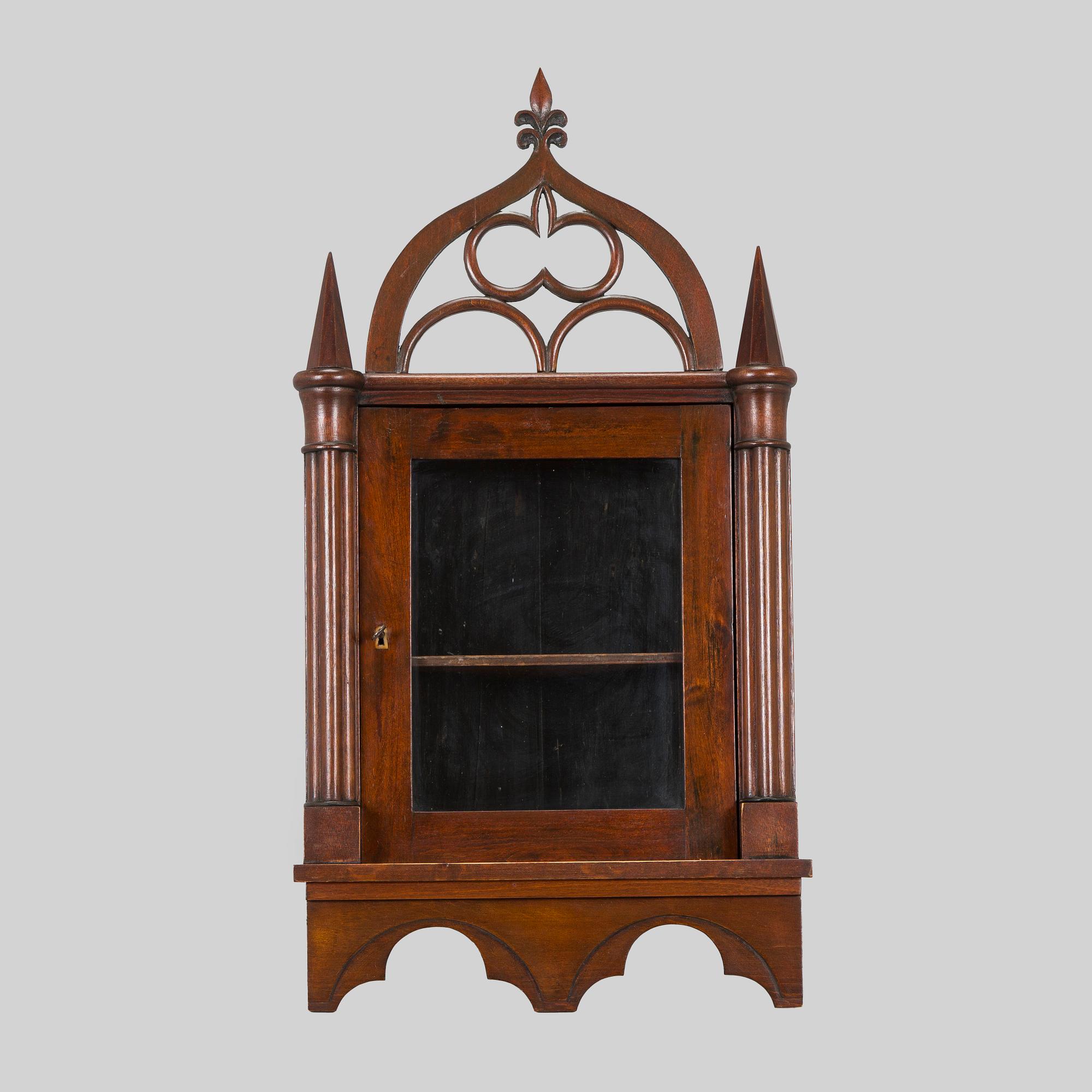 A mid-19th-century wall cabinet.