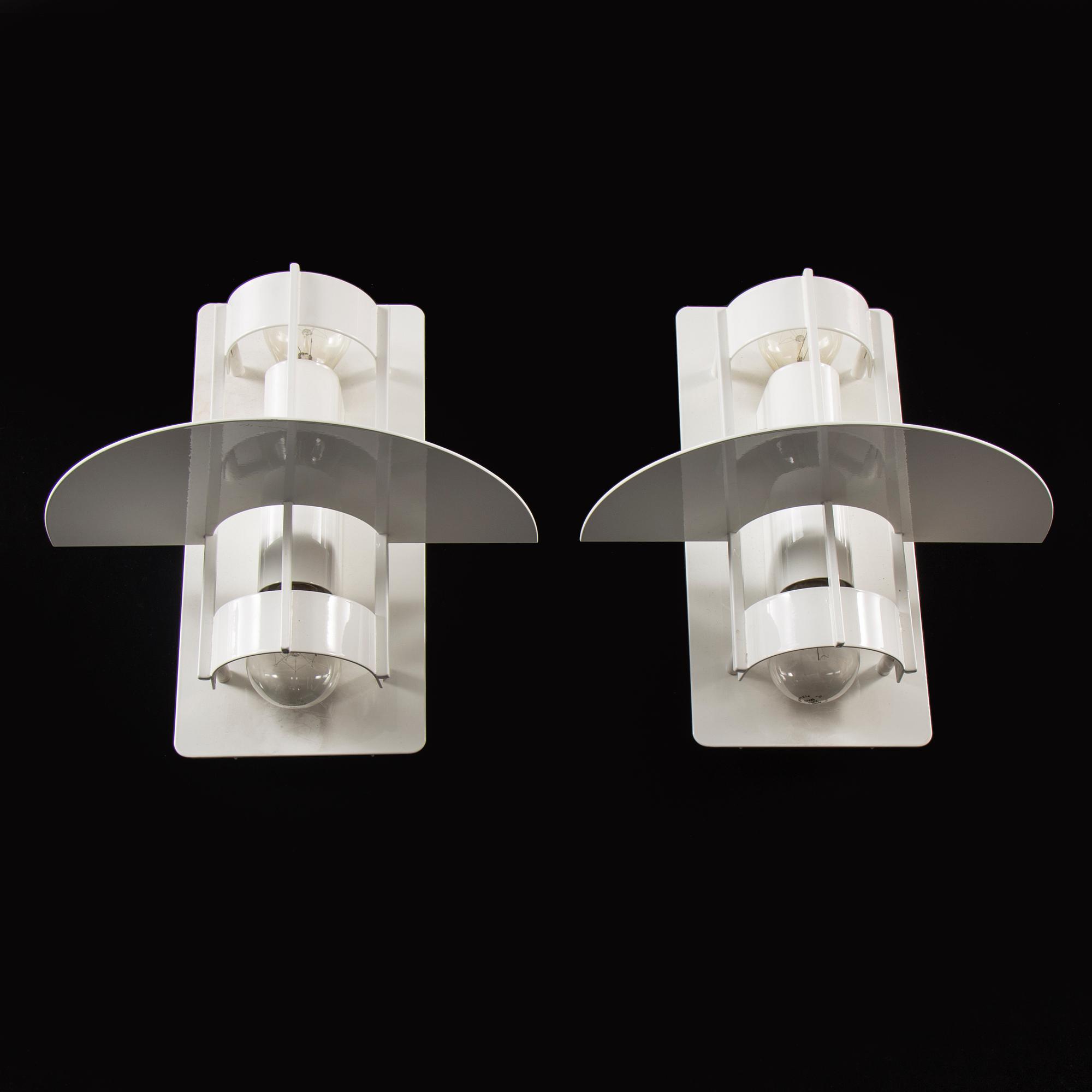 A set of two wall lamps by Joachim Lepper for Louis Poulsen, Danmark.