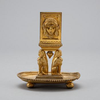 TÄNDSTICKSSTÄLL, empirestil, omkring 1900.