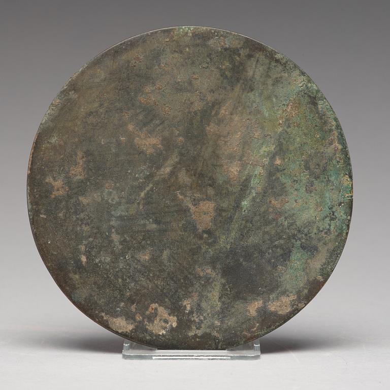 A bronze mirror, Tang dynasty (618-907).