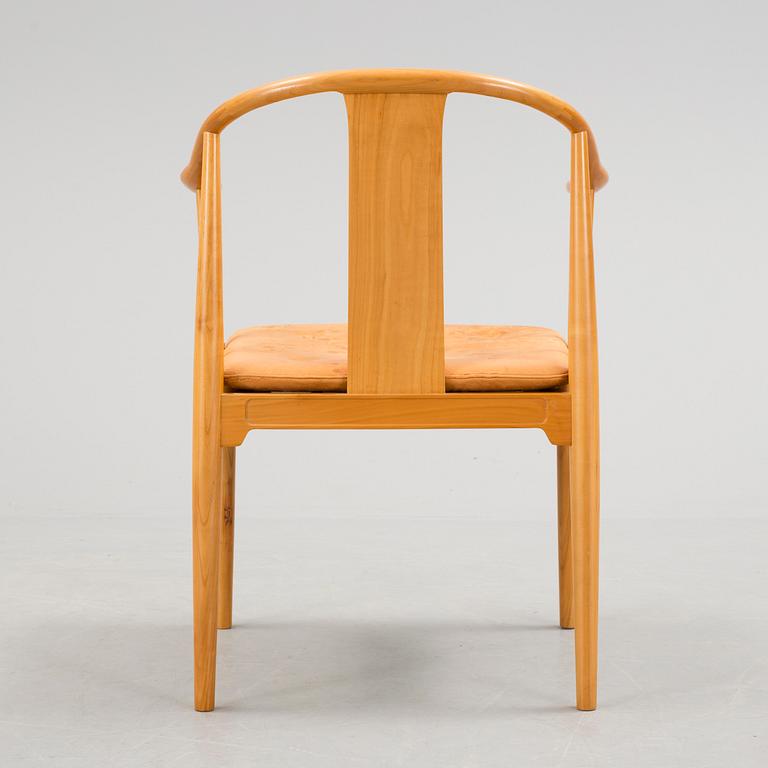 A Hans J Wegner 'Kinastolen' armchair, Fritz Hansen, Denmark 1971.
