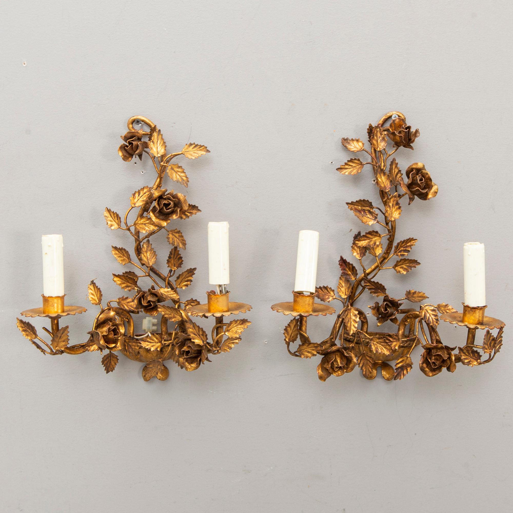 A set of four bronzed Rococo-style walls scones mid 1900s.