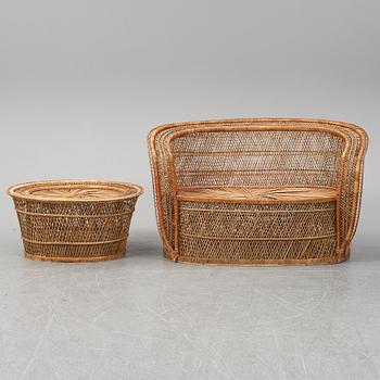 A late 20th Century rattan sofa with table.