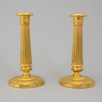 A PAIR OF EMPIRE CANDLESTICKS, first half of the 19th century.