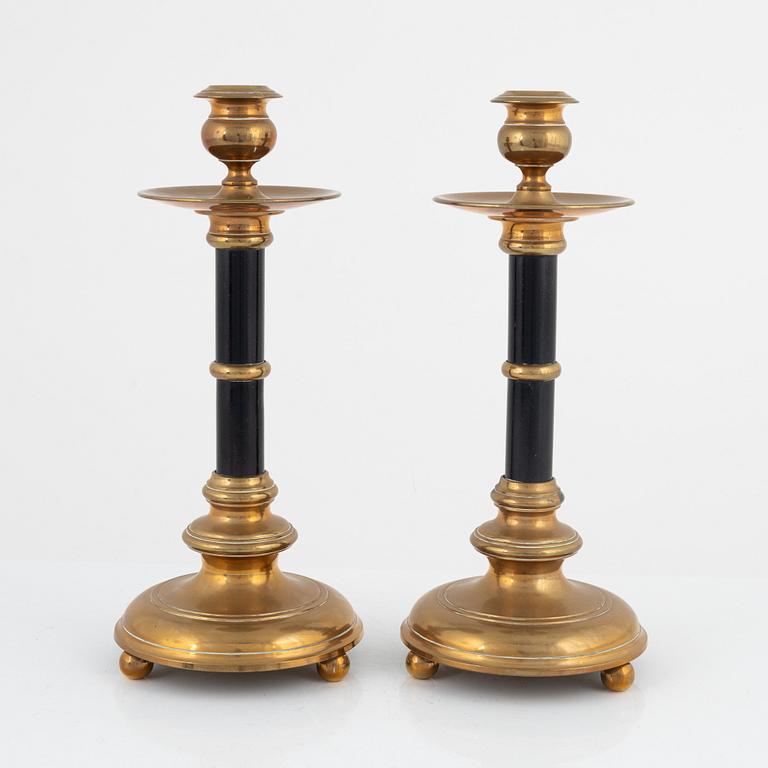 A pair of Skultuna brass and wood candlesticks, first part of the 20th century.