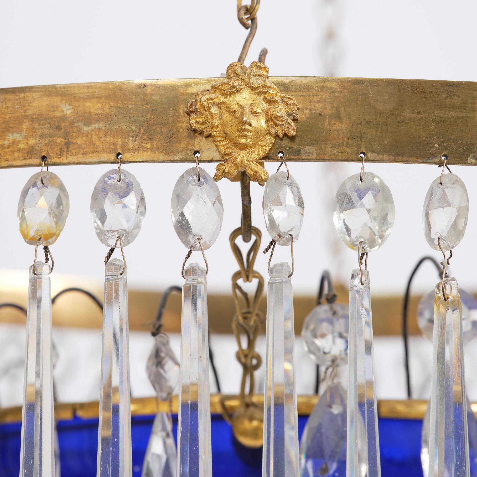 A late Gustavian five-light gilt brass and cut glass chandelier, Stockholm, late 18th century.