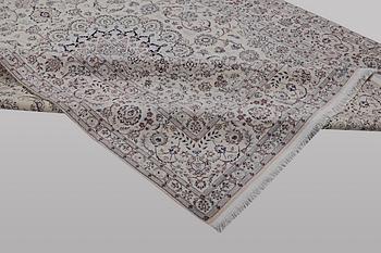A carpet, Nain, part silk, ca 341 x 245 cm.